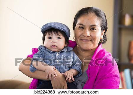 Stock Photo - Hispanic mother posing with son. Fotosearch