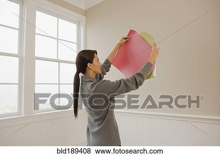 Hispanic woman holding color swatches View Large Photo Image Stock Photo - Hispanic woman holding color swatches. Fotosearch