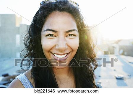 Hispanic woman smiling outdoors View Large Photo Image Stock Photograph - Hispanic woman smiling outdoors. Fotosearch