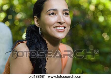 Stock Image - Hispanic woman smiling. Fotosearch