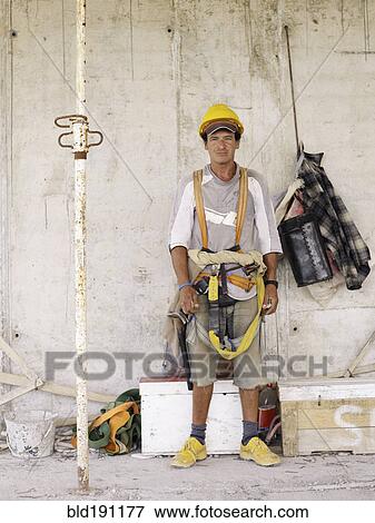 Stock Photo - Hispanic worker on construction site. Fotosearch