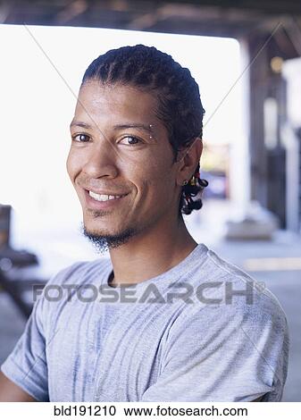 Hispanic worker smiling in factory View Large Photo Image Stock Image - Hispanic worker smiling in factory. Fotosearch
