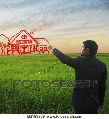 Indian businessman drawing house on sky View Large Photo Image Stock Photo - Indian businessman drawing house on sky. Fotosearch