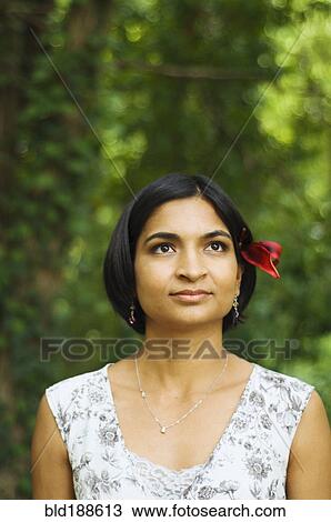 Indian woman with flower in her hair View Large Photo Image Stock Image - Indian woman with flower in her hair. Fotosearch