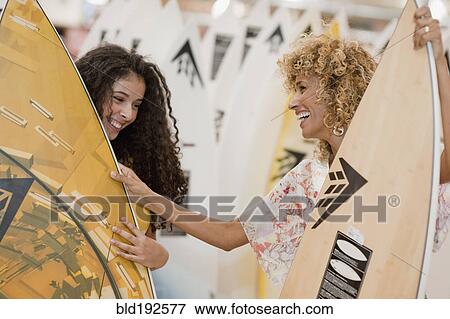 Israeli mother and daughter looking at surfboards View Large Photo Image Stock Photo - Israeli mother and daughter looking at surfboards. Fotosearch