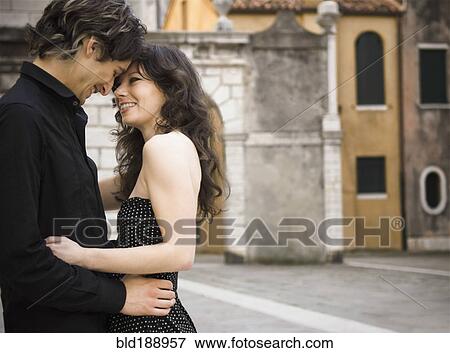 Stock Photo - Italian couple hugging outdoors. Fotosearch