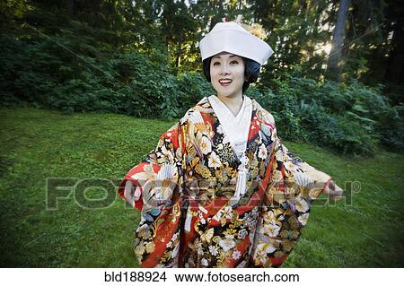 Japanese bride wearing traditional clothing View Large Photo Image Picture - Japanese bride wearing traditional clothing. Fotosearch