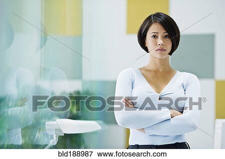 Stock Photo - Japanese businesswoman posing in office. Fotosearch
