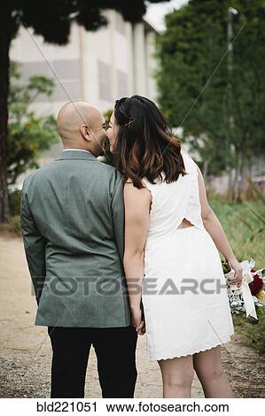 Japanese newlywed couple kissing outdoors View Large Photo Image Stock Image - Japanese newlywed couple kissing outdoors. Fotosearch