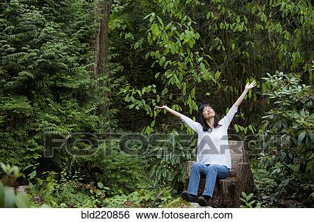 Japanese woman cheering in garden View Large Photo Image Stock Photograph - Japanese woman cheering in garden. Fotosearch