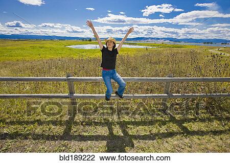 Japanese woman sitting on remote countryside field View Large Photo Image Stock Image - Japanese woman sitting on remote countryside field. Fotosearch