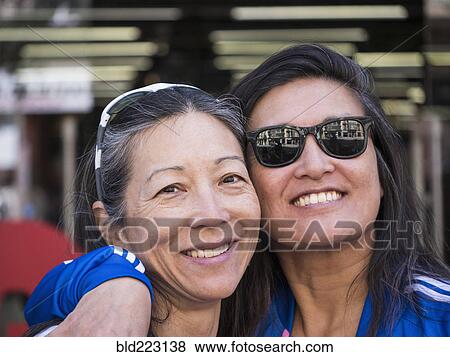 Japanese women posing cheek to cheek View Large Photo Image Stock Photo - Japanese women posing cheek to cheek. Fotosearch