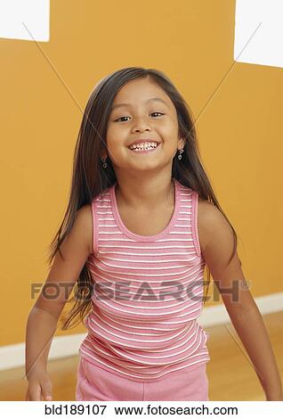 Stock Photo - Laughing Hispanic girl. Fotosearch