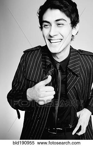 Laughing mixed race man in fashionable coat View Large Photo Image Stock Photography - Laughing mixed race man in fashionable coat. Fotosearch
