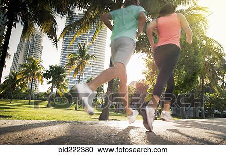 Legs of Caucasian women jogging in city View Large Photo Image Stock Image - Legs of Caucasian women jogging in city. Fotosearch