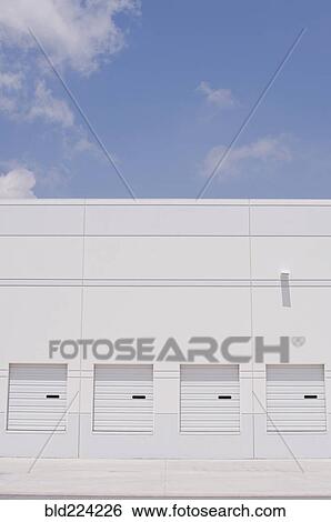 Loading docks under blue sky View Large Photo Image Stock Photograph - Loading docks under blue sky. Fotosearch
