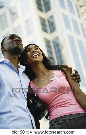 Low angle view of African couple View Large Photo Image Picture - Low angle view of African couple. Fotosearch