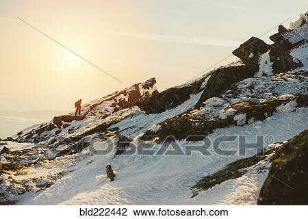 Man hiking on mountain in winter View Large Photo Image Stock Image - Man hiking on mountain in winter. Fotosearch