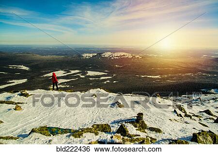 Man hiking on mountain in winter View Large Photo Image Stock Photograph - Man hiking on mountain in winter. Fotosearch