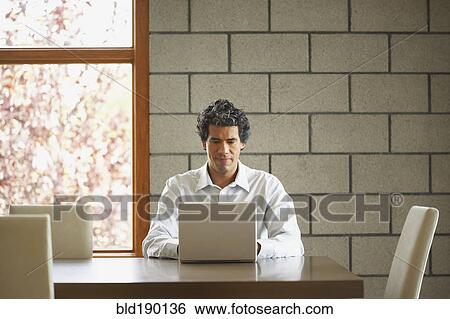 Man typing on laptop View Large Photo Image Stock Photograph - Man typing on laptop. Fotosearch