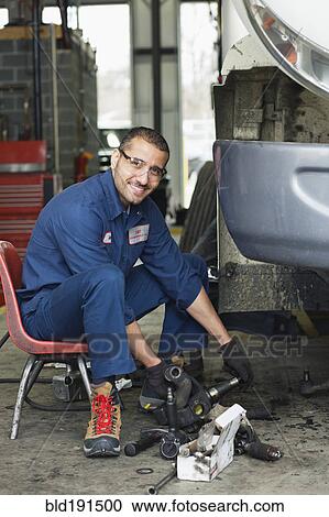 Middle Eastern mechanic repairing automobile View Large Photo Image Stock Image - Middle Eastern mechanic repairing automobile. Fotosearch