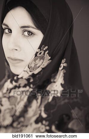 Stock Image - Middle Eastern teenager in headscarf. Fotosearch