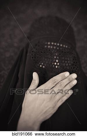 Stock Photograph - Middle Eastern woman in burka. Fotosearch