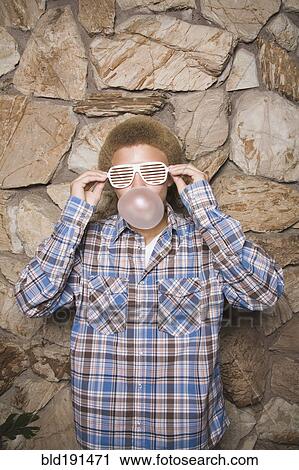 Mixed race boy in sunglasses chewing bubble gum View Large Photo Image Stock Image - Mixed race boy in sunglasses chewing bubble gum. Fotosearch