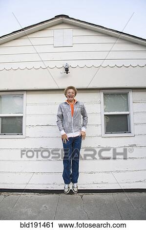 Mixed race boy jumping in mid-air View Large Photo Image Stock Image - Mixed race boy jumping in mid-air. Fotosearch