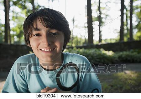 Stock Image - Mixed race boy smiling. Fotosearch