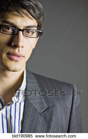 Stock Photography - Mixed race businessman in eyeglasses. Fotosearch