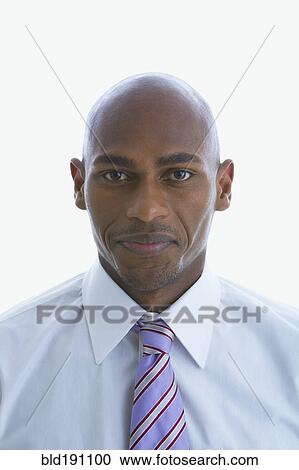 Stock Image - Mixed race businessman smiling. Fotosearch