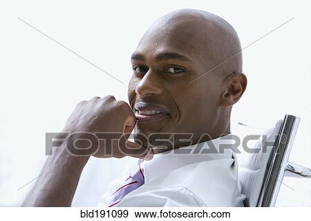 Mixed race businessman smiling View Large Photo Image Stock Photo - Mixed race businessman smiling. Fotosearch