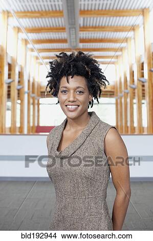 Picture - Mixed race businesswoman smiling. Fotosearch