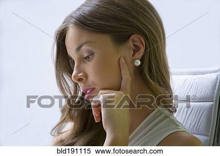 Mixed race businesswoman working at desk View Large Photo Image Stock Photography - Mixed race businesswoman working at desk. Fotosearch