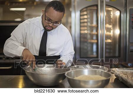 Mixed race chef with down syndrome cooking in restaurant View Large Photo Image Stock Image - Mixed race chef with down syndrome cooking in restaurant. Fotosearch