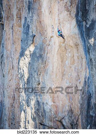 Mixed Race girl climbing rock View Large Photo Image Stock Photography - Mixed Race girl climbing rock. Fotosearch