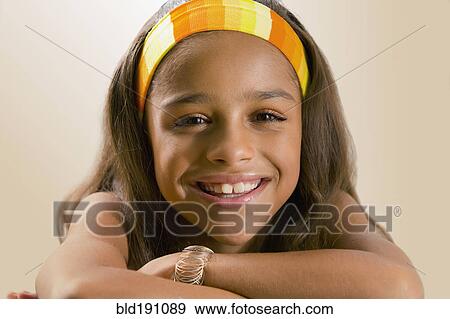 Stock Photo - Mixed race girl smiling. Fotosearch