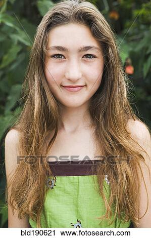 Stock Image - Mixed Race girl with long hair. Fotosearch