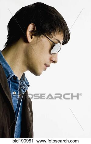 Stock Image - Mixed race man in sunglasses. Fotosearch