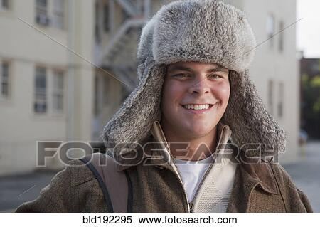 Mixed race man wearing fur hat View Large Photo Image Stock Photography - Mixed race man wearing fur hat. Fotosearch