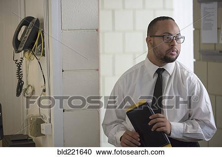 Mixed race server working in restaurant View Large Photo Image Stock Image - Mixed race server working in restaurant. Fotosearch
