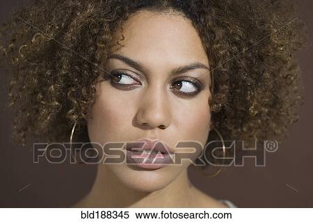 Mixed Race woman looking sideways View Large Photo Image Stock Photography - Mixed Race woman looking sideways. Fotosearch