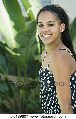 Mixed race woman posing outdoors View Large Photo Image Stock Photo - Mixed race woman posing outdoors. Fotosearch