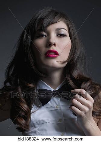 Picture - Mixed Race woman wearing bowtie. Fotosearch