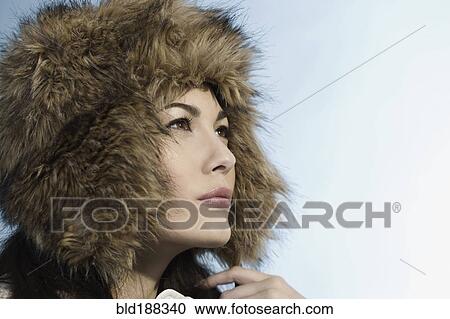 Mixed Race woman wearing fur hat View Large Photo Image Stock Image - Mixed Race woman wearing fur hat. Fotosearch
