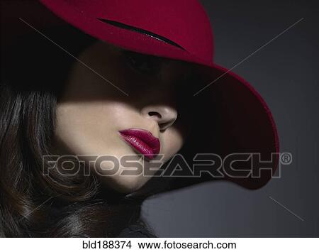 Picture - Mixed Race woman wearing hat. Fotosearch