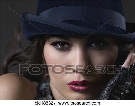 Stock Photo - Mixed Race woman wearing hat. Fotosearch
