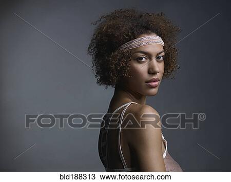 Mixed Race woman wearing headband View Large Photo Image Stock Image - Mixed Race woman wearing headband. Fotosearch