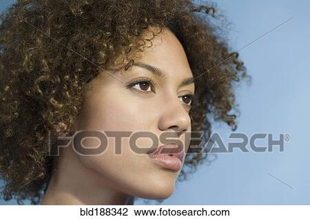 Mixed Race Woman With Curly Hair Stock Image Bld188342 Fotosearch